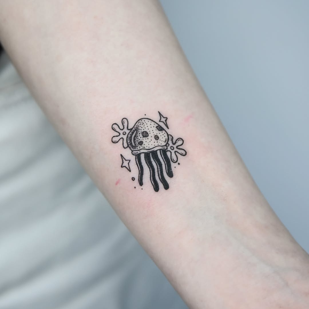 Charming black ink jellyfish with whimsical flair Tattoo Design