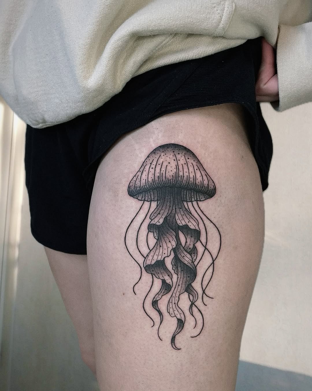 Charming jellyfish tattoo on a thigh Tattoo Design