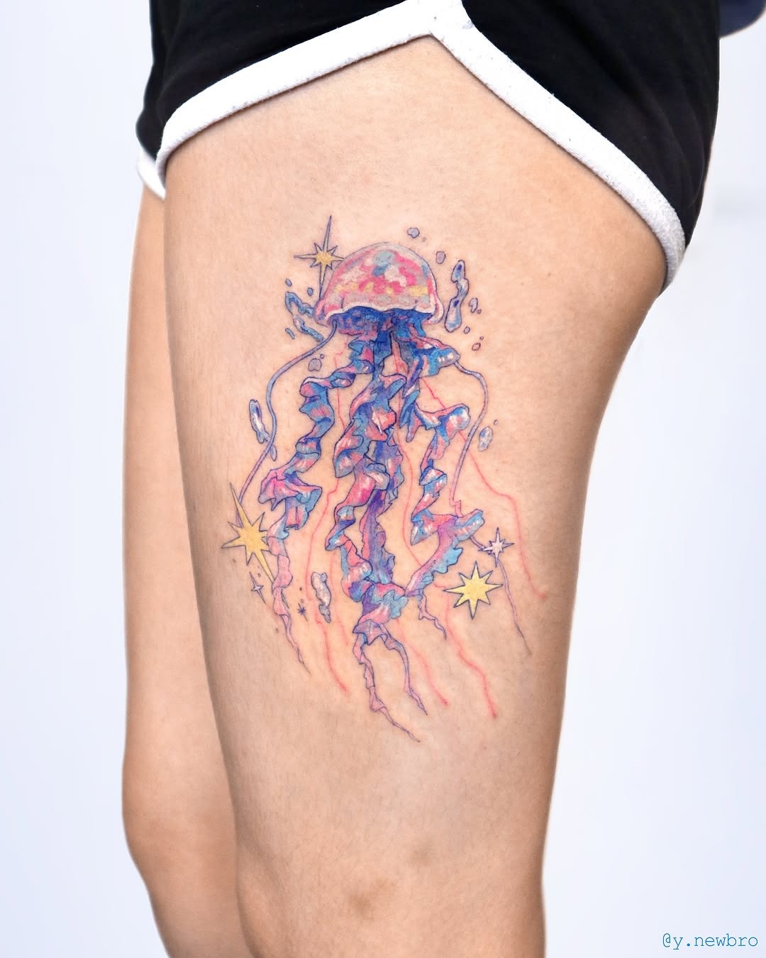Colorful jellyfish tattoo radiating whimsical vibes Tattoo Design