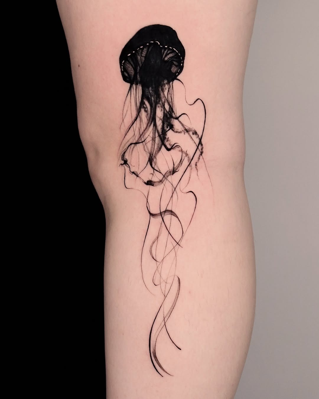 Elegant black jellyfish tattoo on the thigh Tattoo Design
