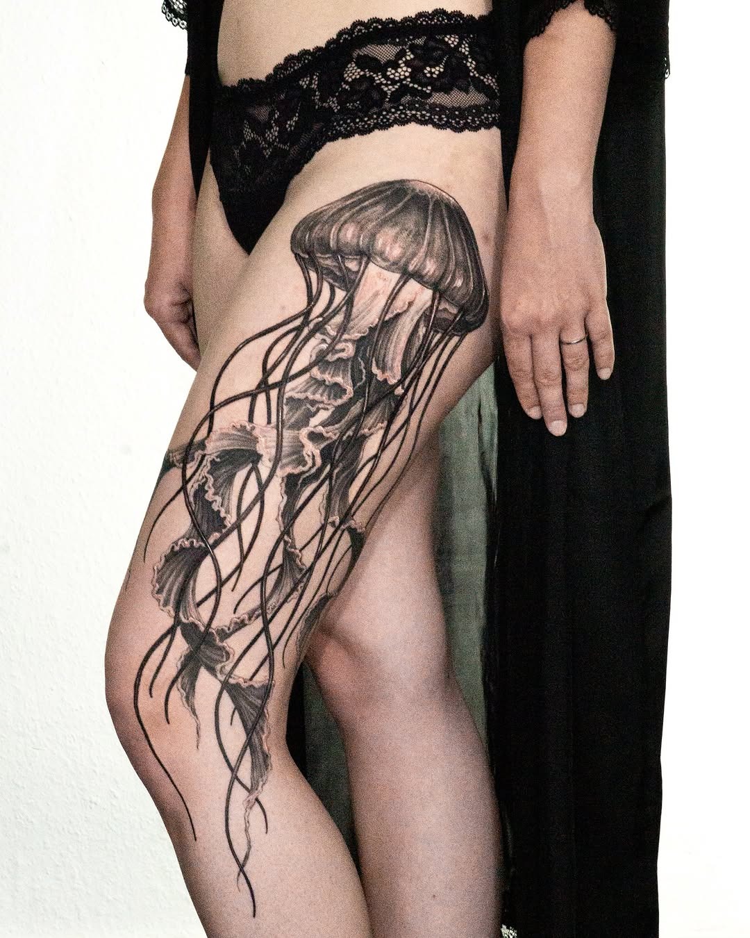 Elegant jellyfish tattoo on feminine thigh Tattoo Design