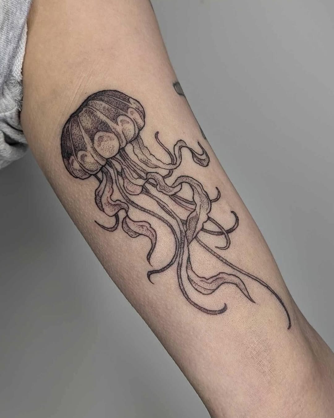 Elegant jellyfish tattoo with delicate linework Tattoo Design