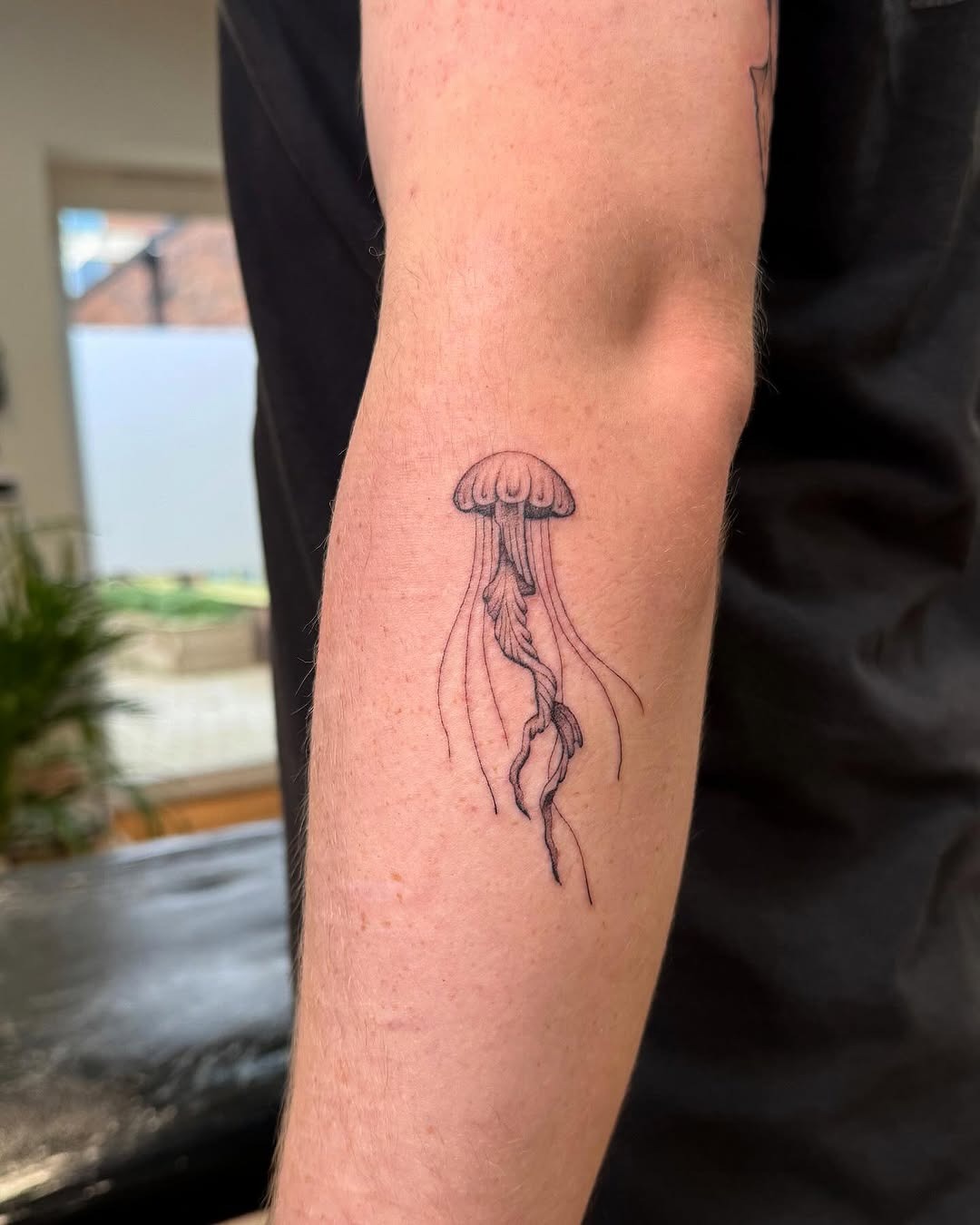 Elegant jellyfish tattoo with flowing tentacles Tattoo Design