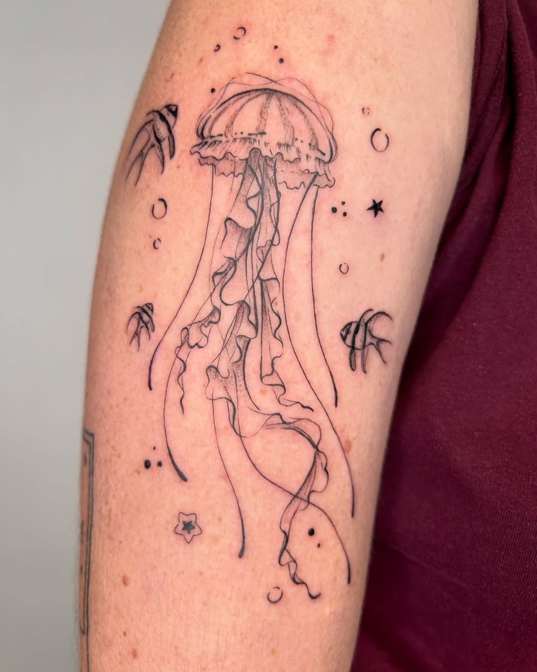 Elegant jellyfish tattoo with flowing tentacles Tattoo Design