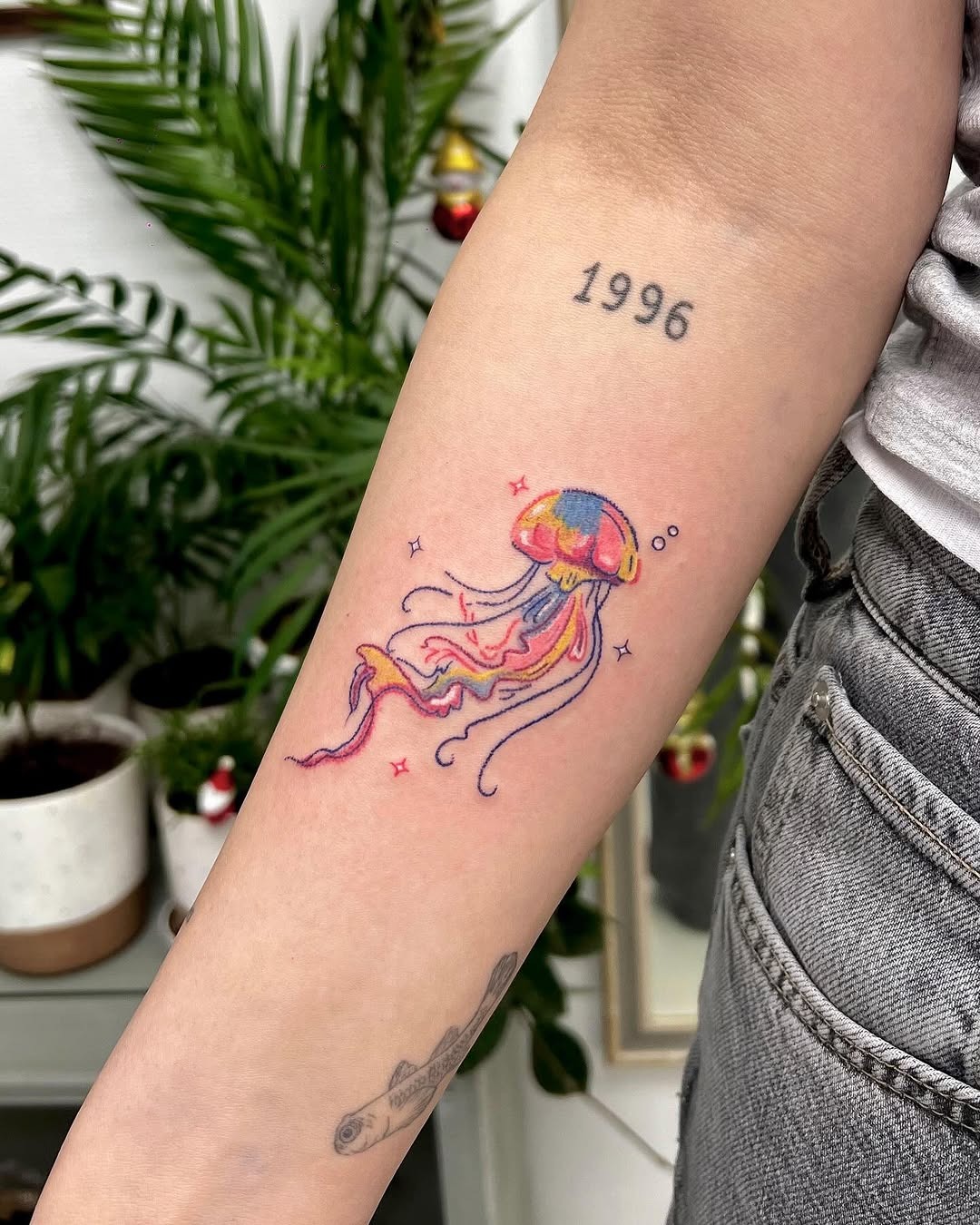 Vibrant jellyfish tattoo with playful details Tattoo Design