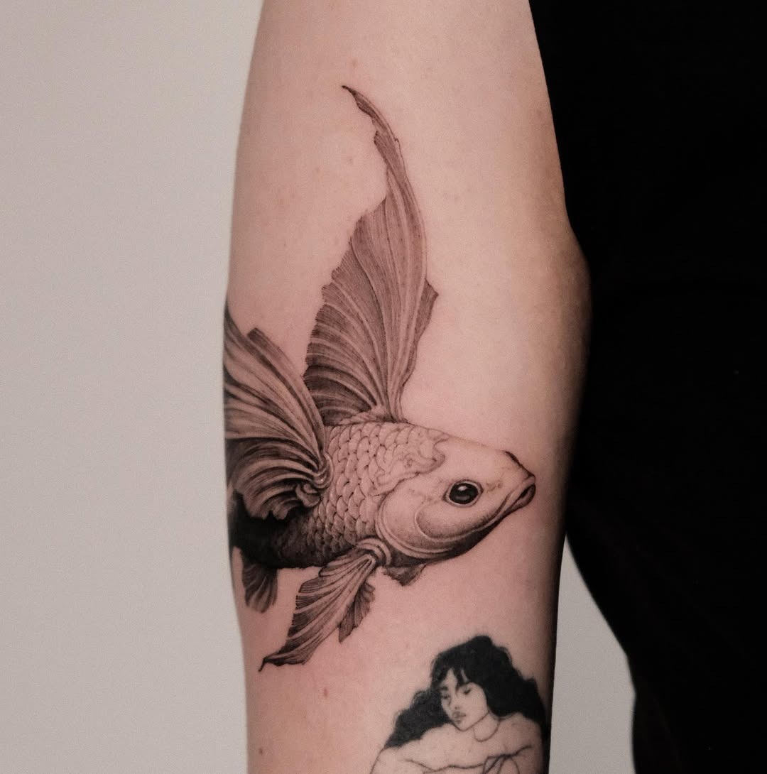 This stunning koi fish tattoo showcases intricate detailing and lifelike movement.