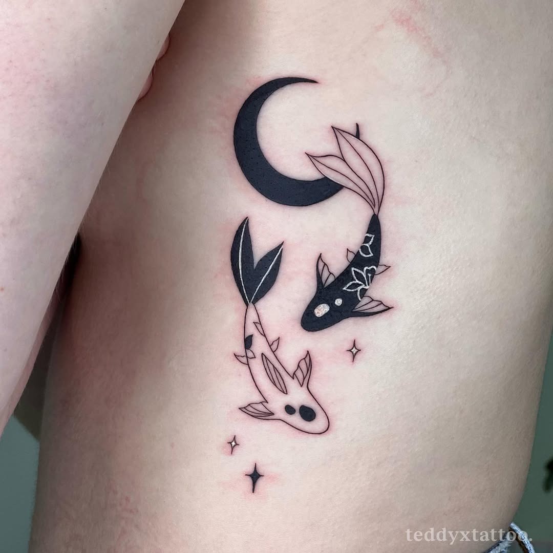 This tattoo beautifully features koi fish swimming gracefully beneath a crescent moon, surrounded by delicate stars.