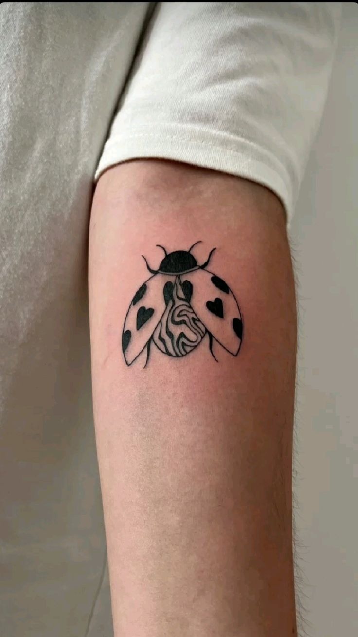 Open-Wing Ladybug Tattoo With Heart Details Tattoo Design