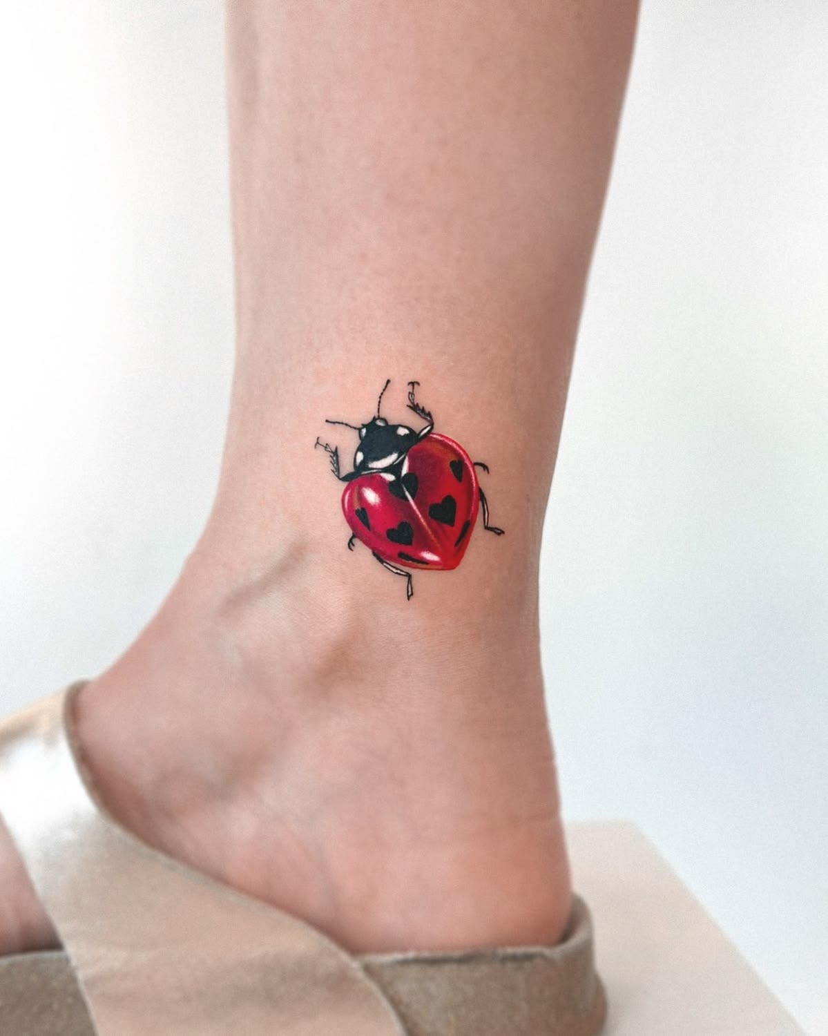 Red Ladybug Tattoo With Heart-Shaped Spots Tattoo Design