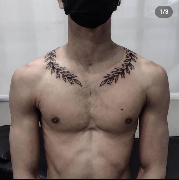 Slender Laurel Flutter at the Back of the Arm Tattoo Design
