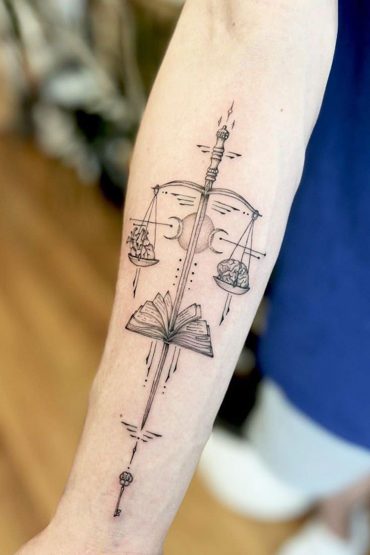 Sword, Book & Scales Forearm Tattoo Design