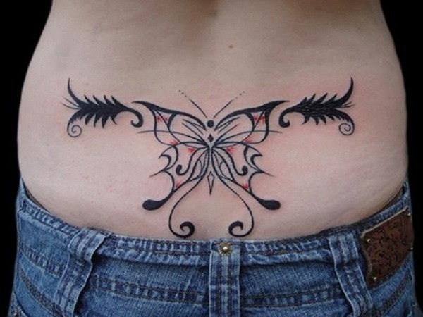 This bold tattoo design merges a butterfly motif with tribal patterns, emphasizing symmetry and style.