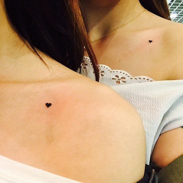 A Sun and Moon Matching tattoos on two Women's sides Tattoo Design