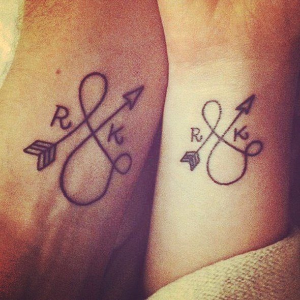 Matching cross tattoos with triangles at the edges Tattoo Design