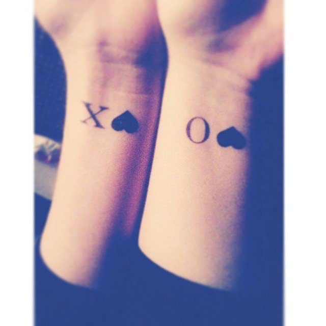 Rocket and Saturn matching tattoos on a woman's hands Tattoo Design