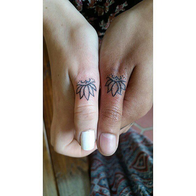 Two flower and band matching tattoos on the hand Tattoo Design