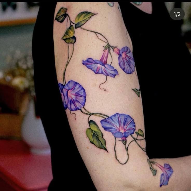 Saturated Trumpets with Botanical Leaves Tattoo Design