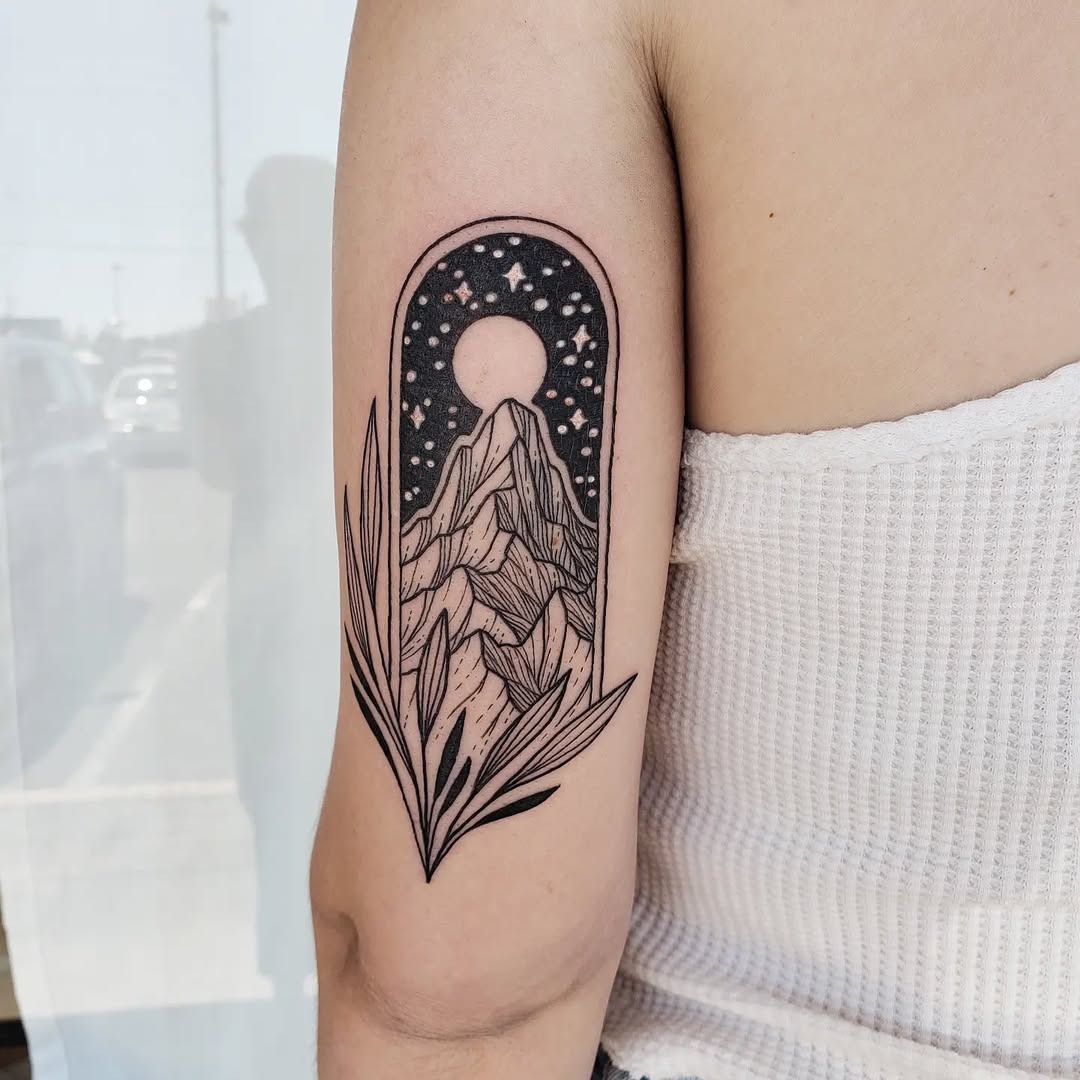 A striking mountain tattoo with celestial elements Tattoo Design