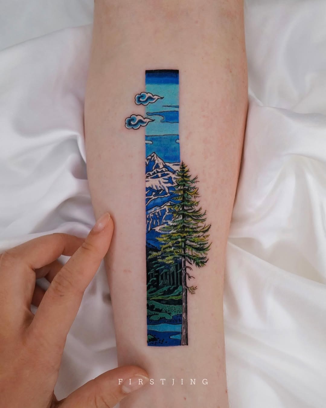 A stunning mountain scenery tattoo on the arm Tattoo Design