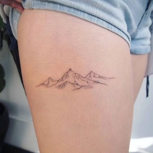 Delicate mountain tattoo on the thigh Tattoo Design