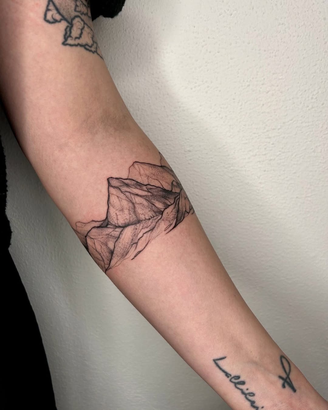 Elegant mountain tattoo showcasing intricate line work Tattoo Design