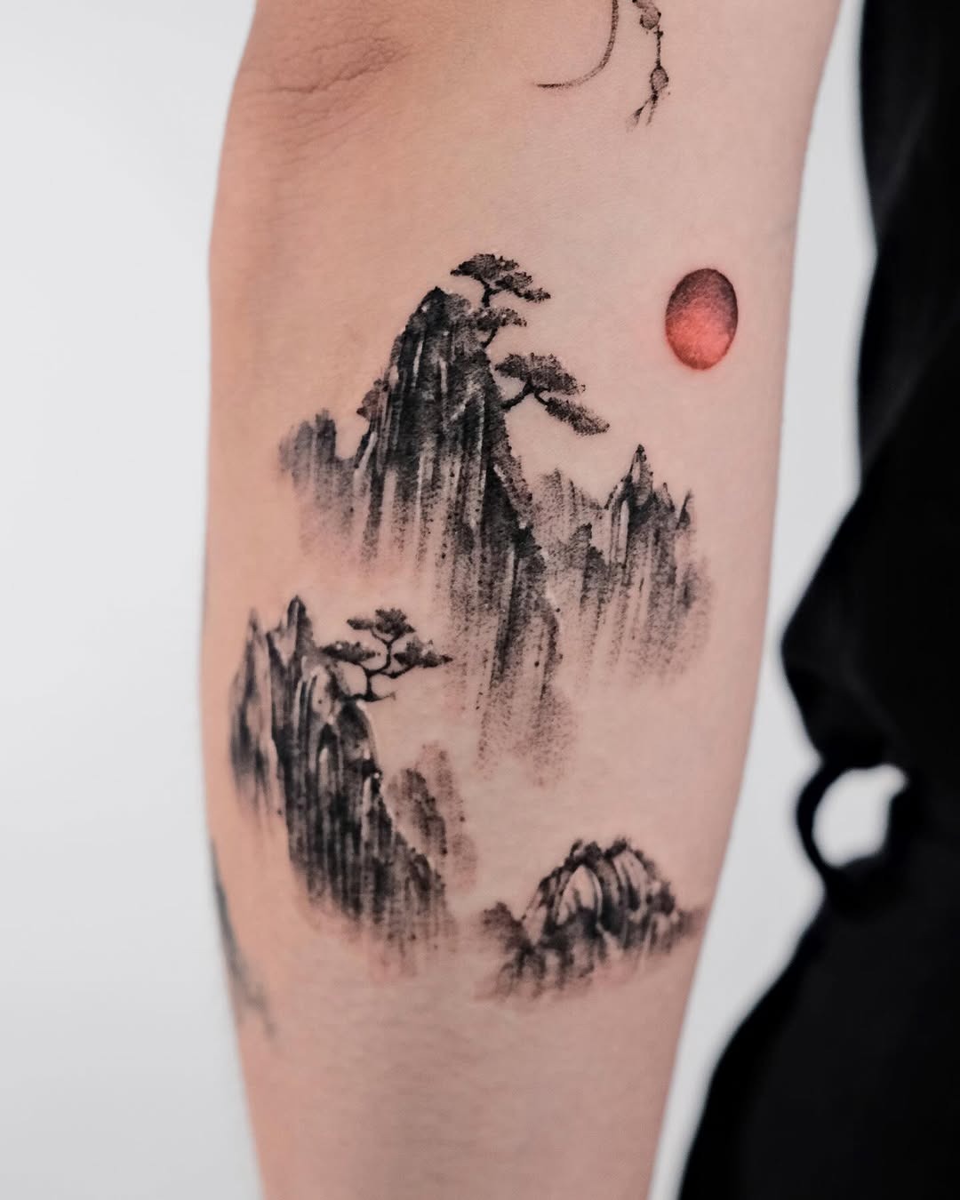 Intricate mountain tattoo with red sun highlight Tattoo Design
