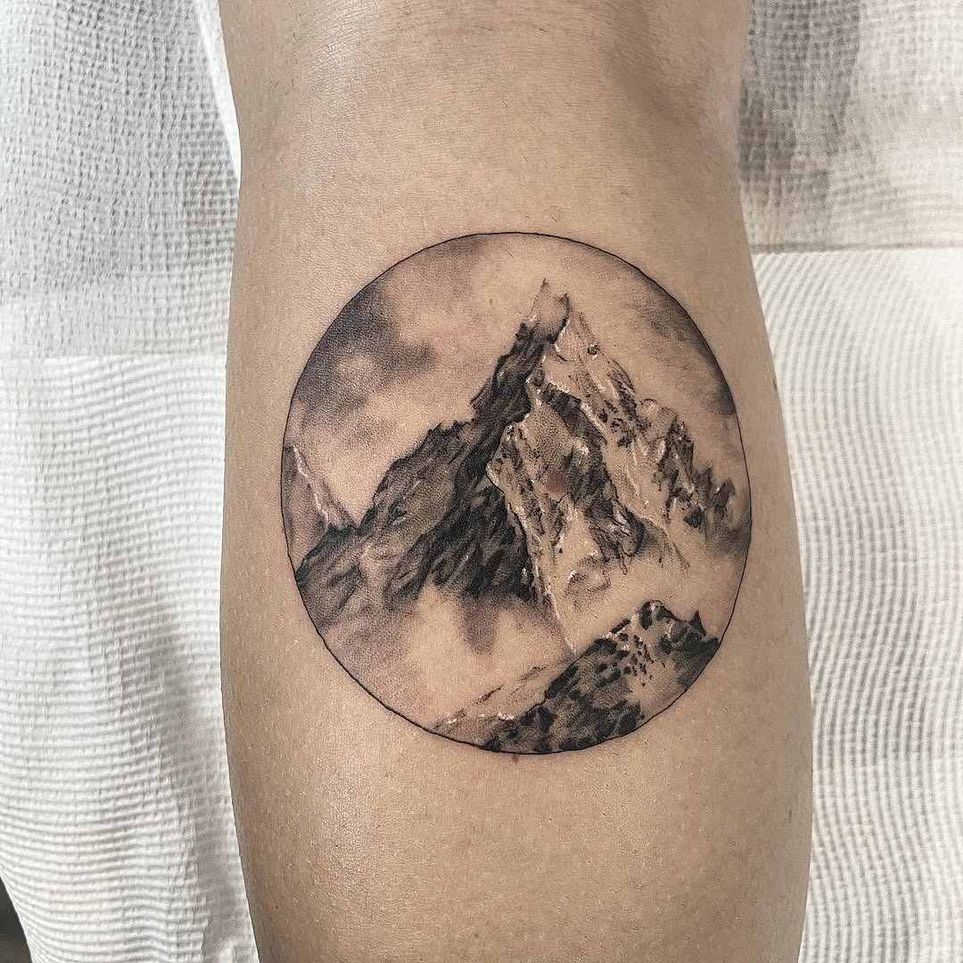 Stunning mountain scene captured in a circle Tattoo Design