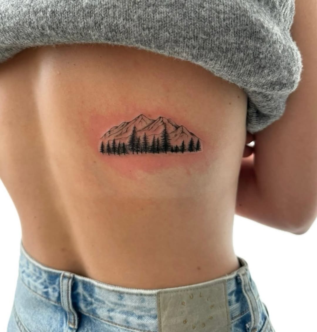 Stunning mountain scene with tree silhouettes Tattoo Design