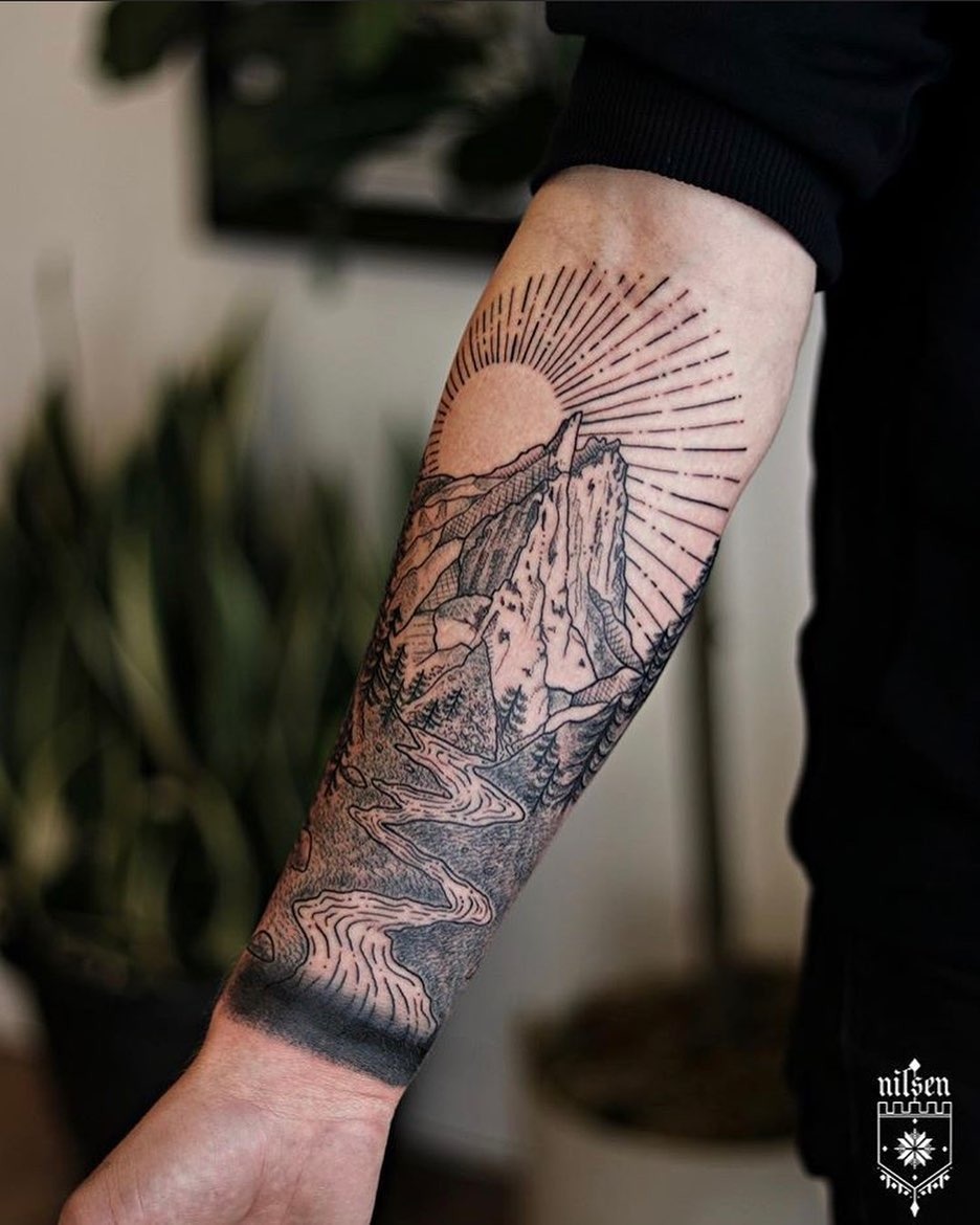 Stunning mountain scenery tattoo on forearm Tattoo Design