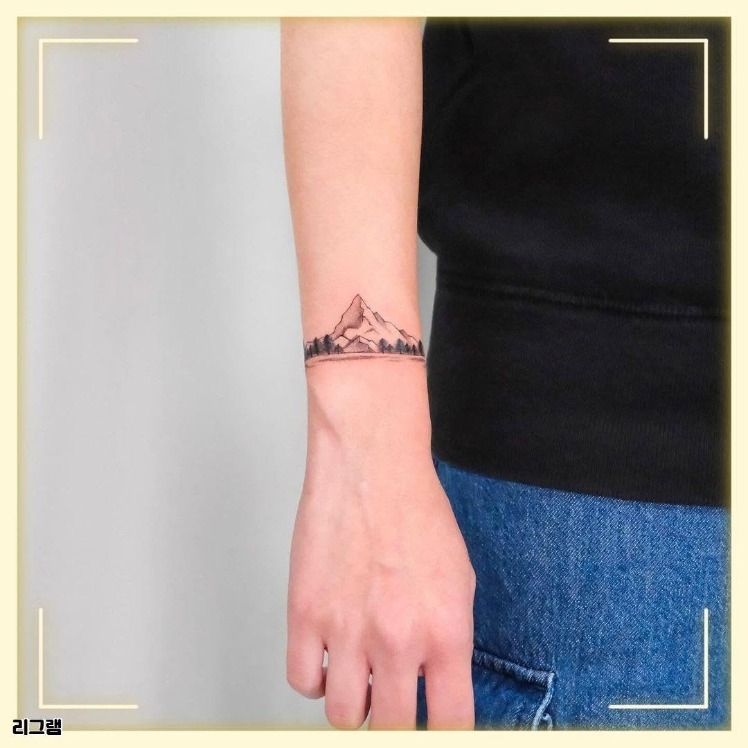 Trendy minimalistic mountain tattoo on wrist Tattoo Design