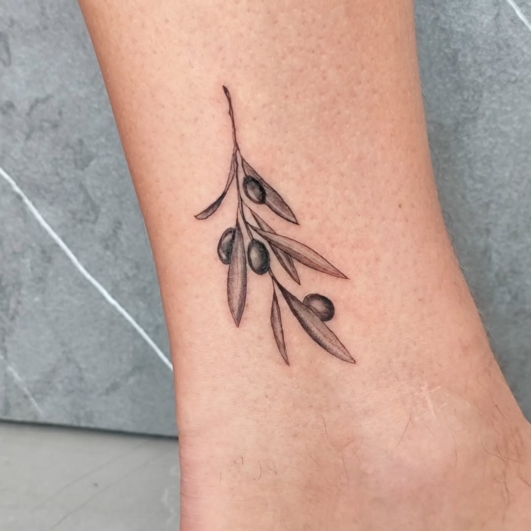 Delicate olive branch tattoo on ankle design. Tattoo Design