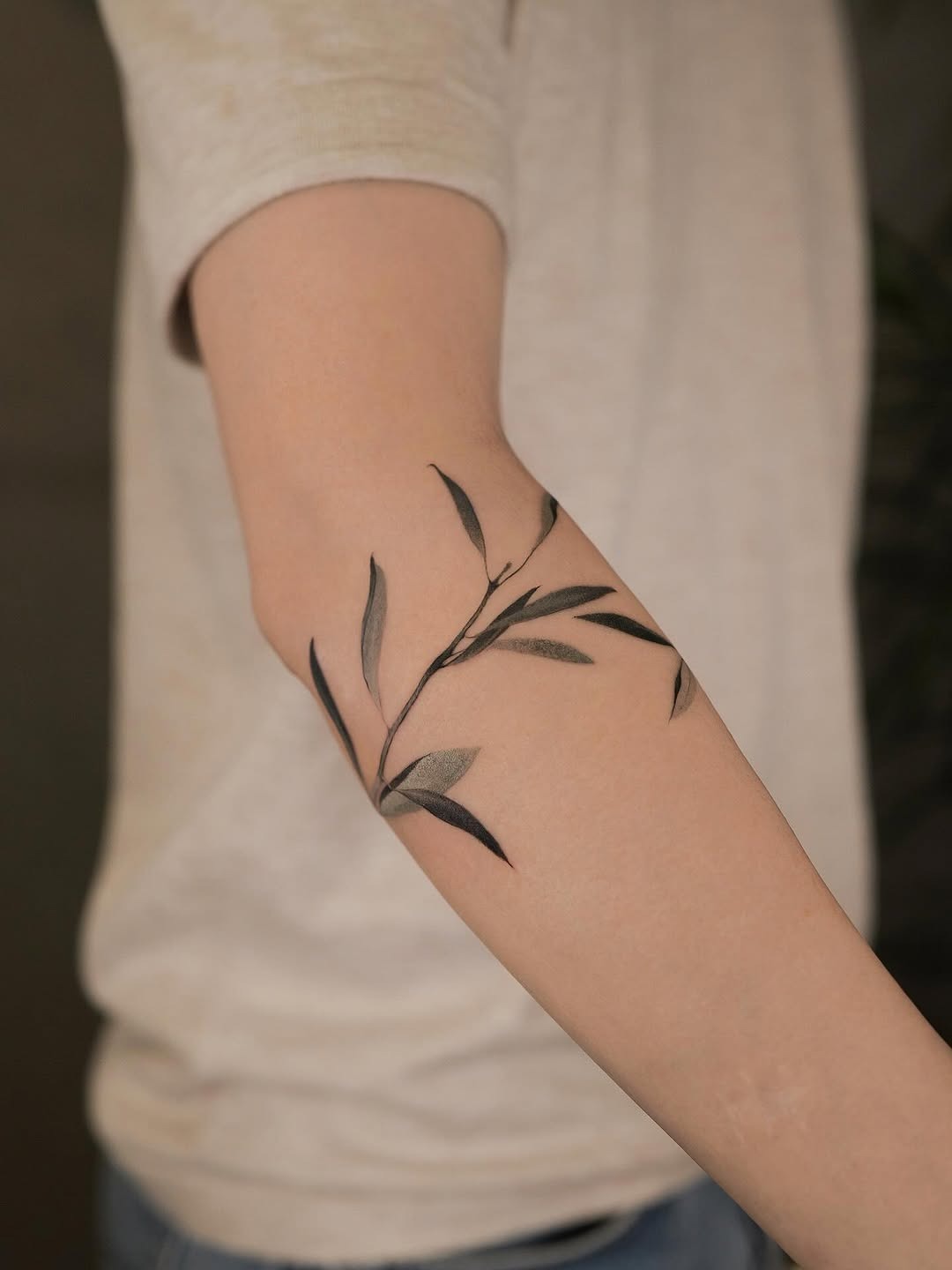 Elegant olive branch tattoo on forearm Tattoo Design