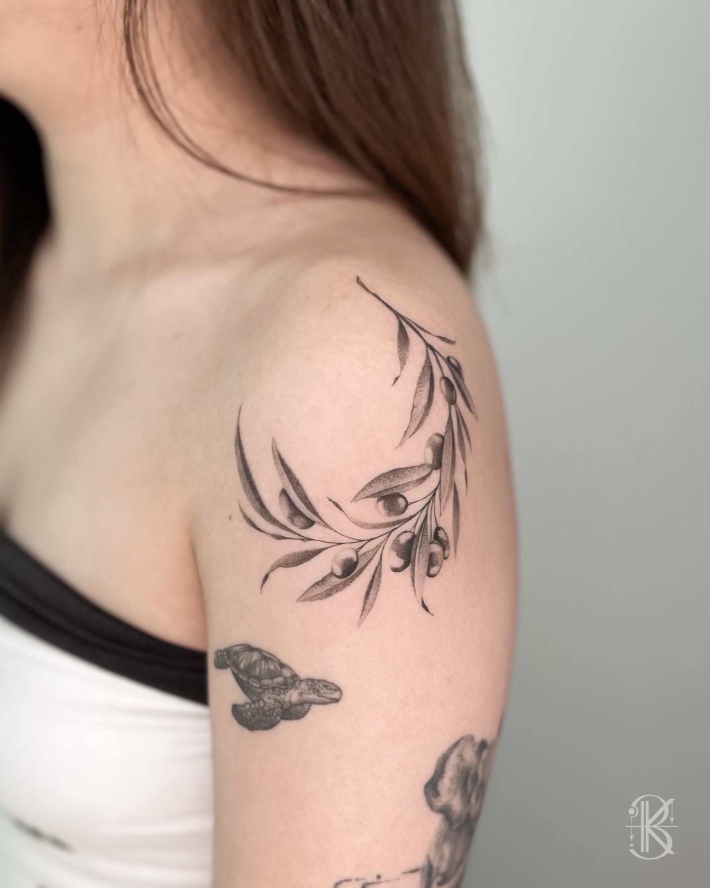 Elegant olive branch tattoo on shoulder Tattoo Design