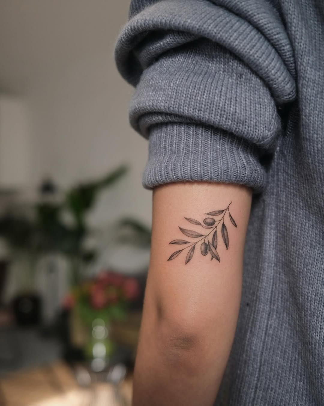 Elegant olive branch tattoo on the forearm Tattoo Design