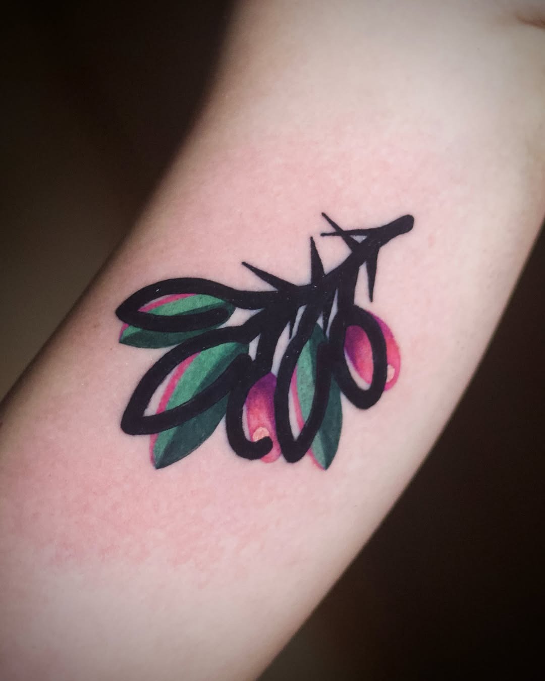 Elegant olive branch tattoo with vibrant colors Tattoo Design