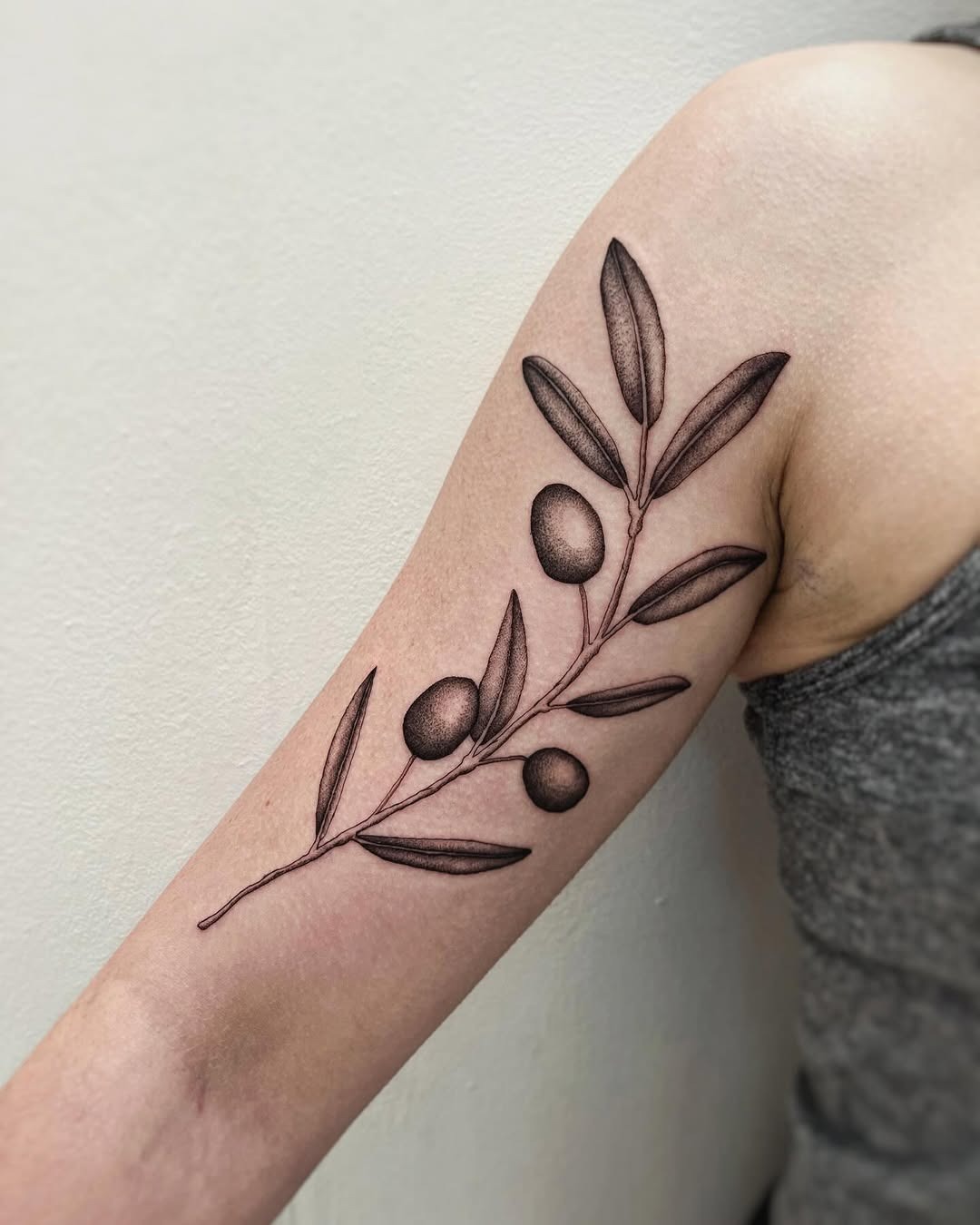 Stylish olive branch tattoo on the forearm Tattoo Design