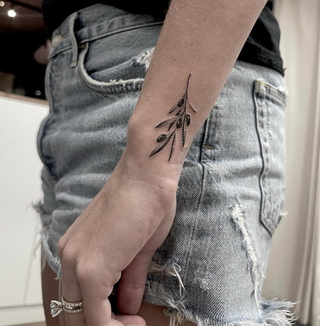 Stylish olive branch tattoo on the forearm Tattoo Design