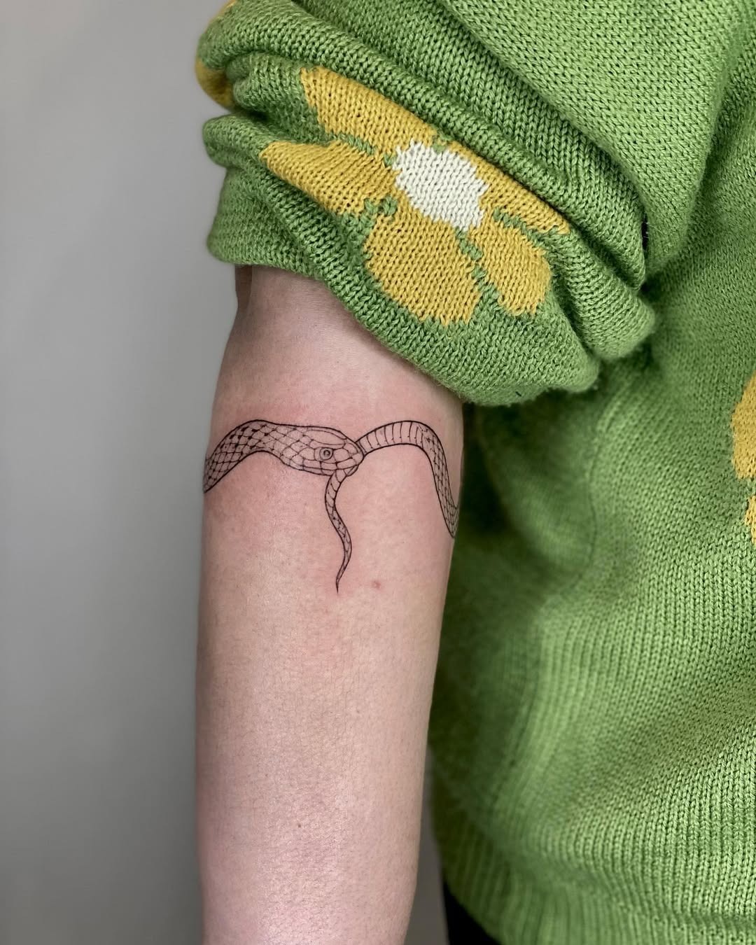 Elegant ouroboros tattoo in simple line art Tattoo Design
