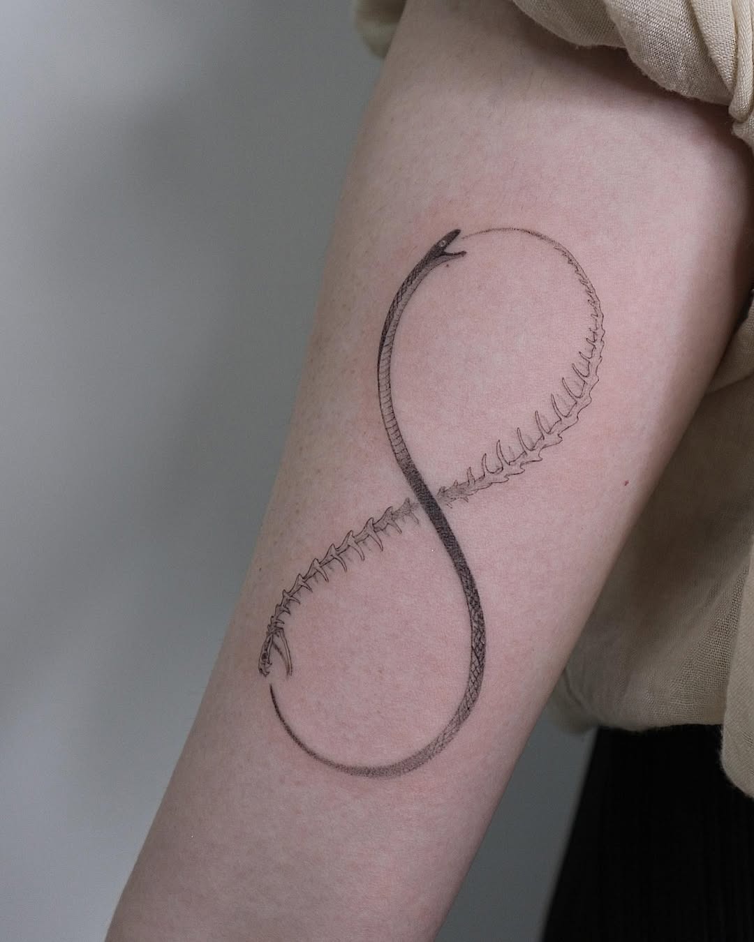 Elegant ouroboros tattoo symbolizing eternity Tattoo Design