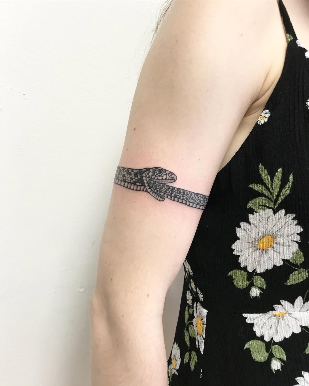 Elegant ouroboros tattoo with floral aesthetics Tattoo Design