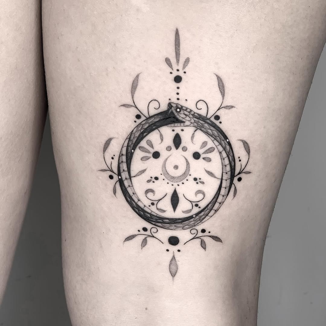 Elegant ouroboros tattoo with intricate designs Tattoo Design