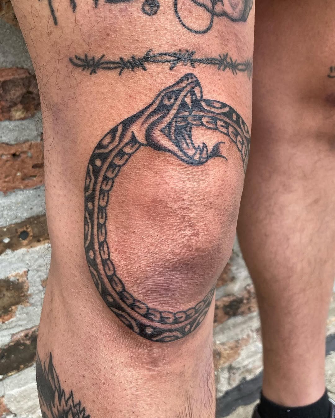 Fierce Ouroboros Snake Tattoo on Knee Tattoo Design
