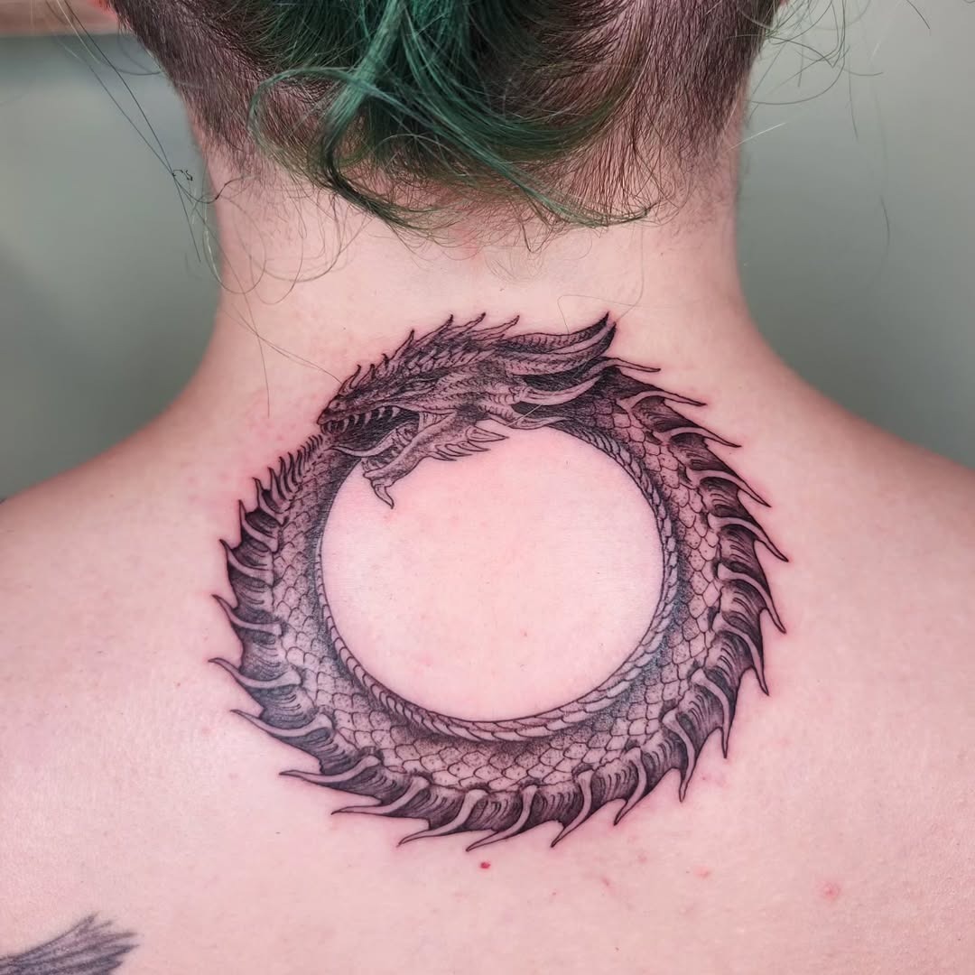 Intricate ouroboros tattoo showcasing timeless cycle Tattoo Design