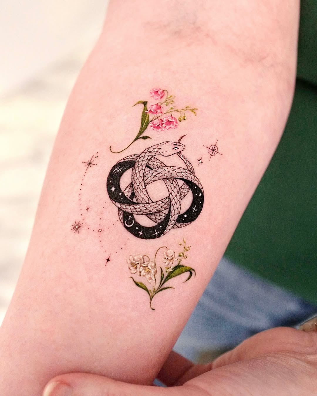 Intricate ouroboros tattoo with floral elements Tattoo Design