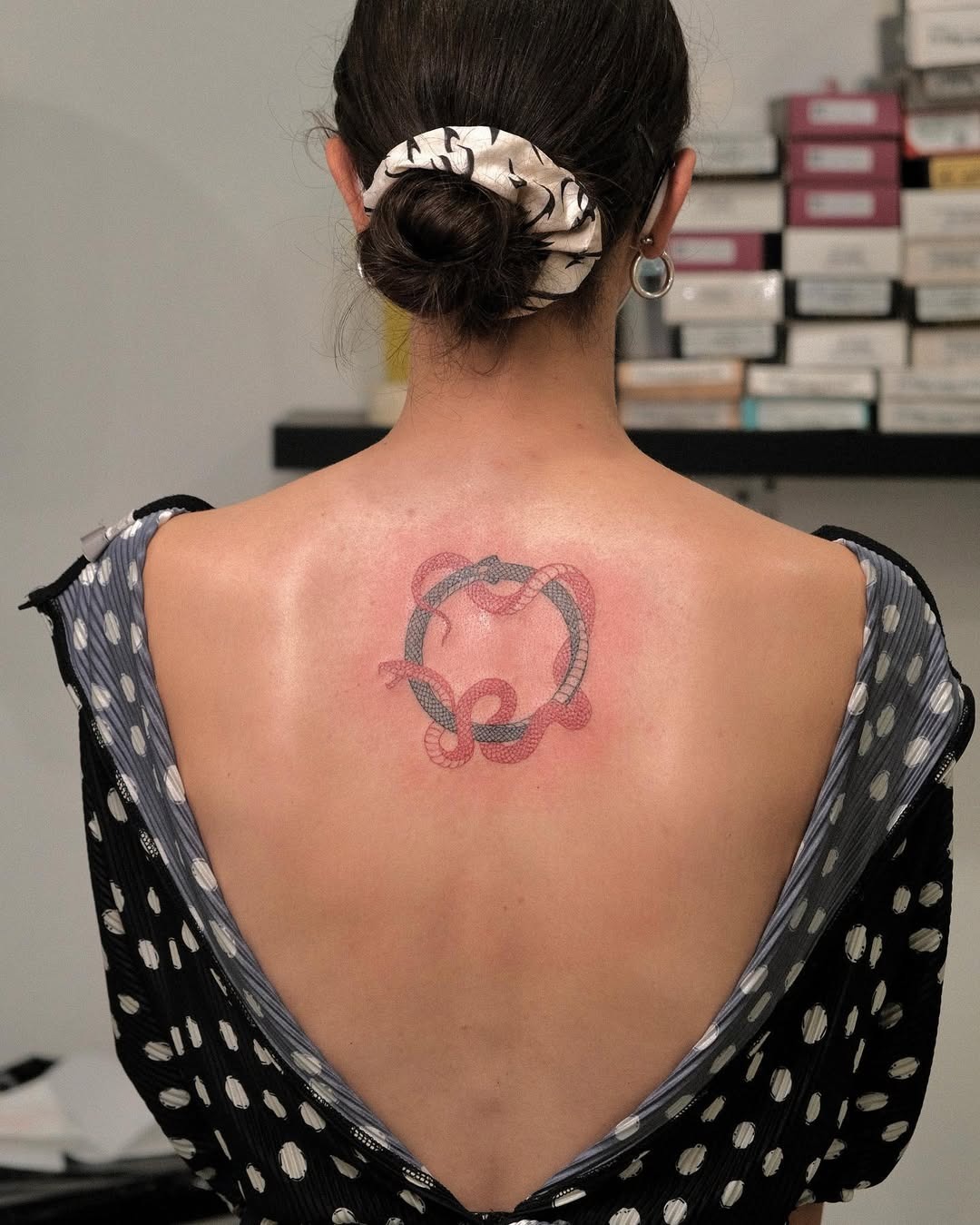 Intricate Ouroboros Tattoo with Subtle Color Tattoo Design
