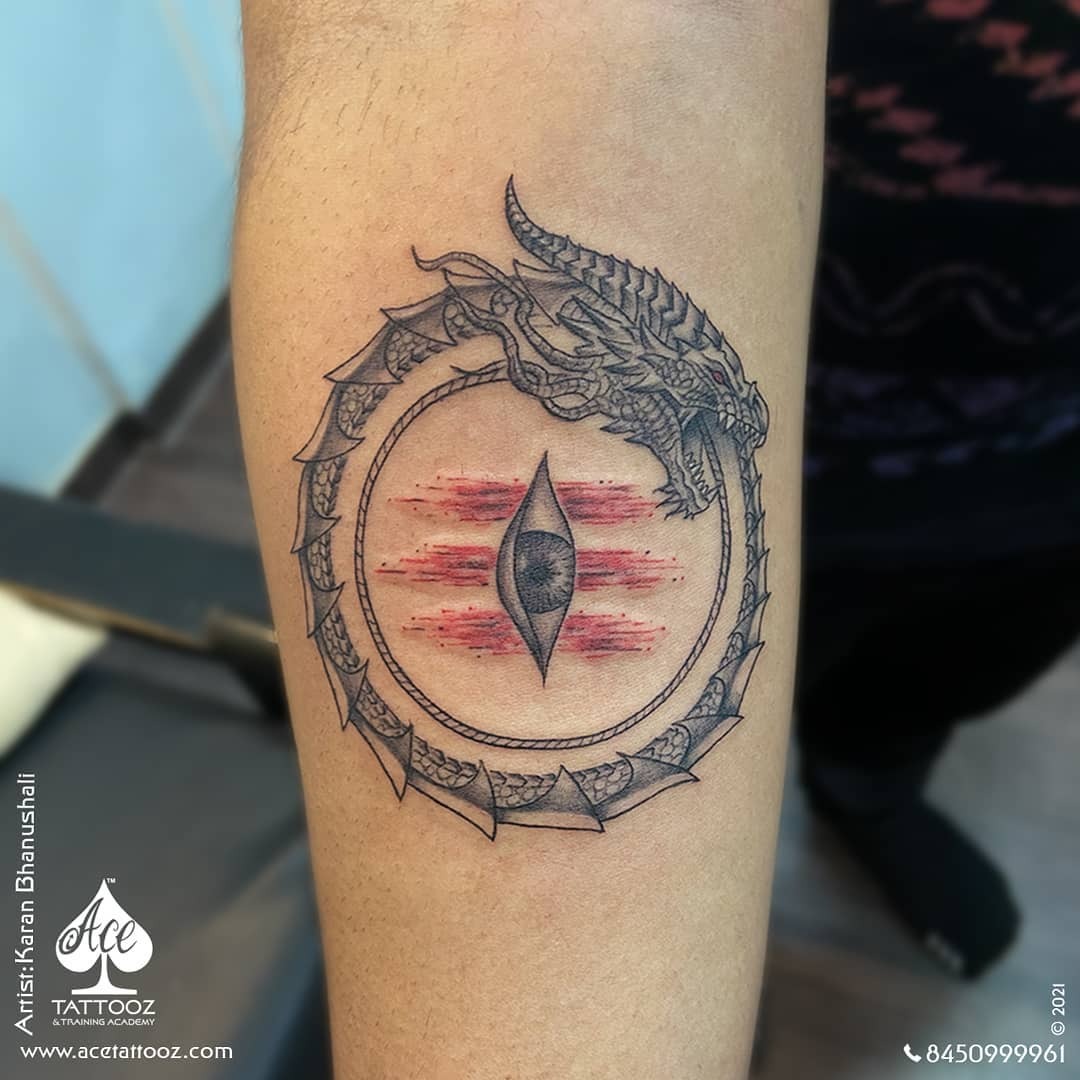 Intricate ouroboros with dragon and eye detail Tattoo Design