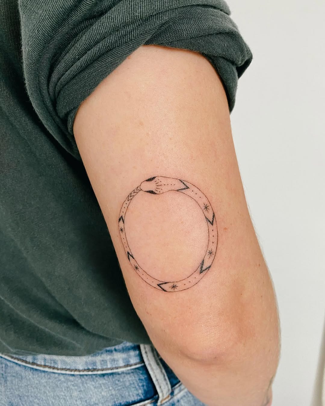 Minimalist ouroboros tattoo symbolizes eternity Tattoo Design