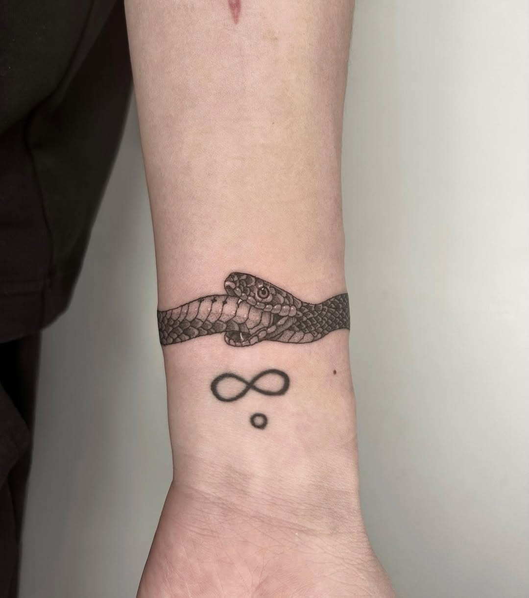 Symbiotic design of snake and infinity symbol Tattoo Design