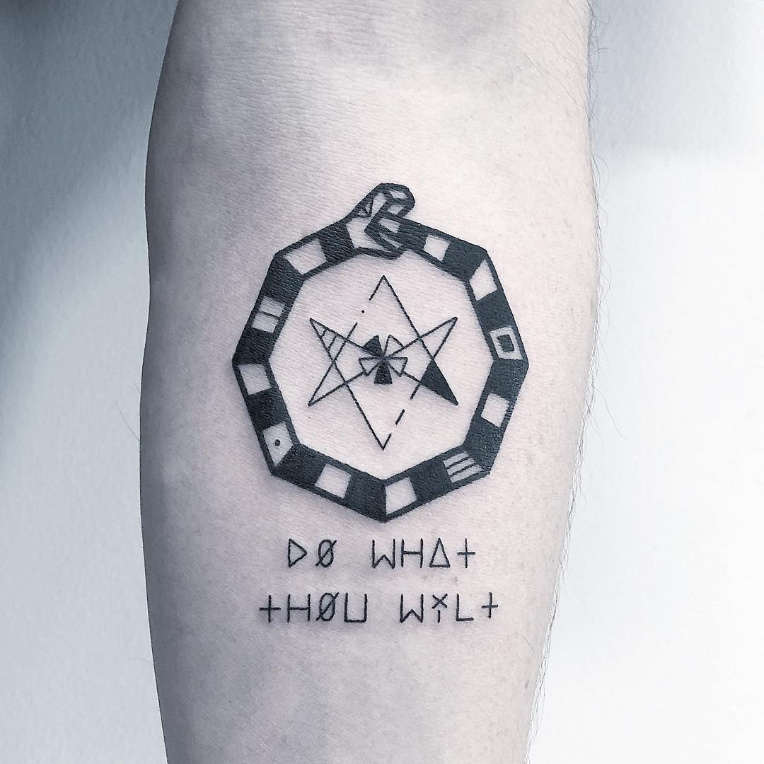Symbolic ouroboros tattoo with mystic elements Tattoo Design