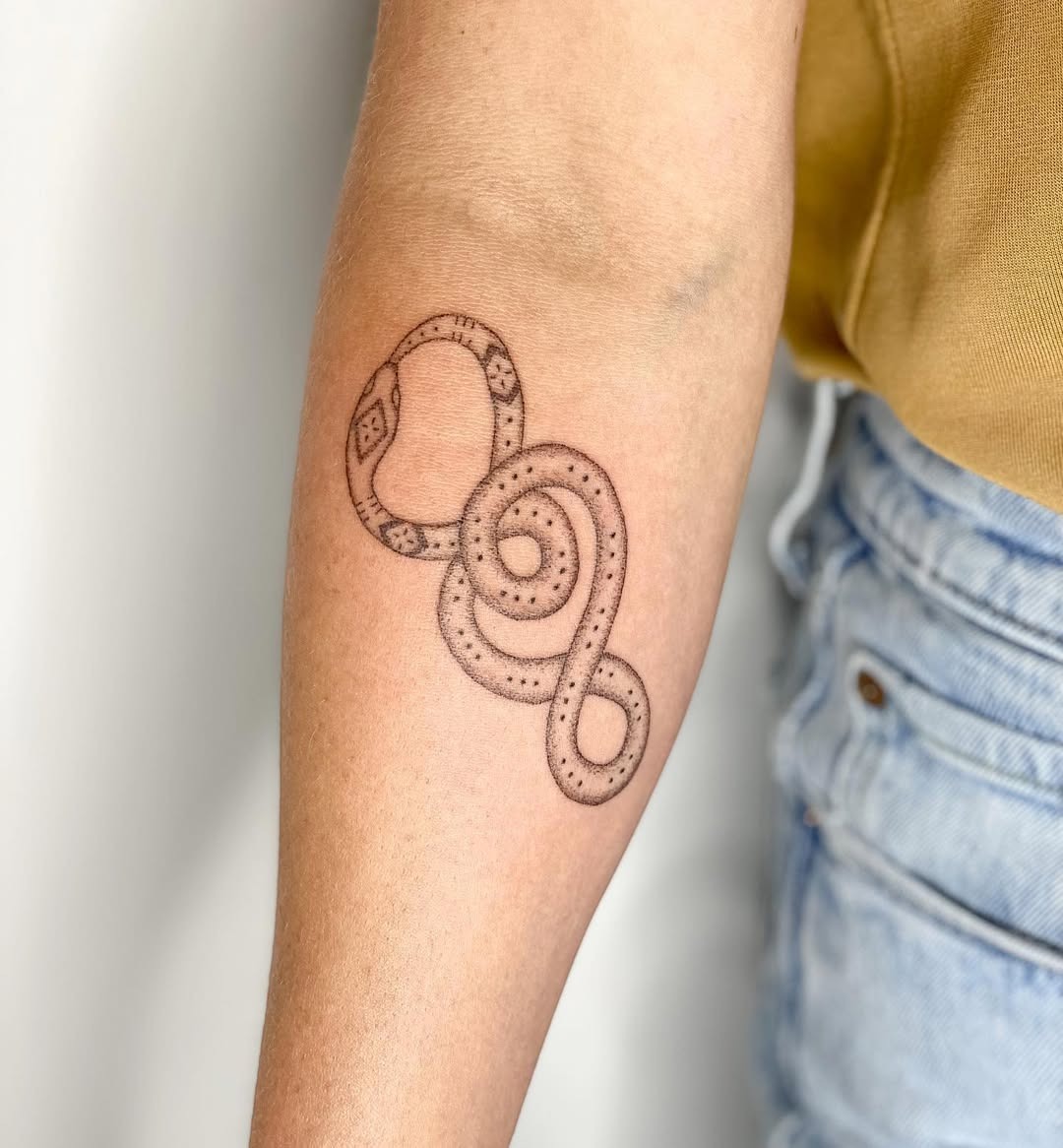 Unique ouroboros serpent tattoo on forearm Tattoo Design